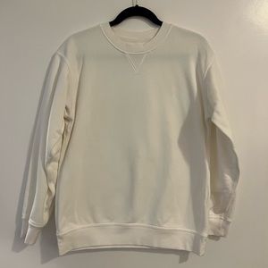Lululemon white sweatshirt. One small stain shown in 2nd photo. Worn 2-4 times.